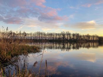 Scenic view of lake against sky during sunset