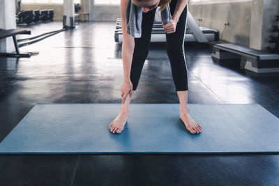 Low section of woman walking on floor