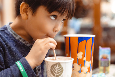 Close-up of boy eating food