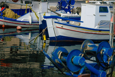 Boats moored at harbor