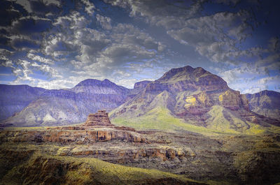 Scenic view of rocky mountains against sky