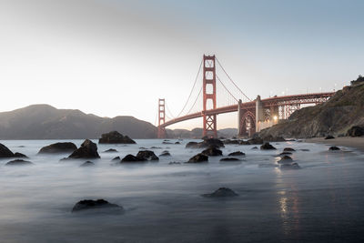 View of suspension bridge over sea