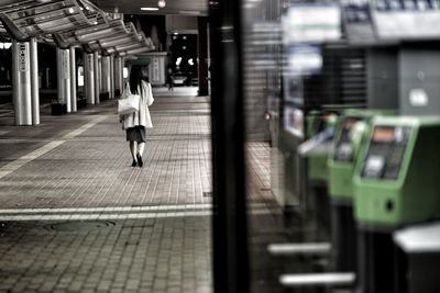 Full length of woman walking on subway station