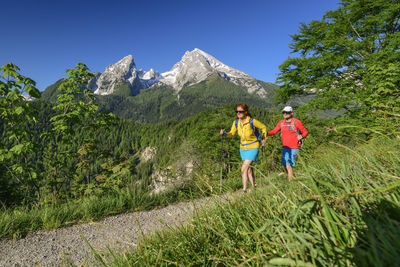 Full length of woman on mountain against sky