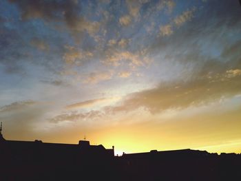 Silhouette of built structure at sunset