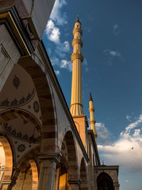 Low angle view of cathedral against cloudy sky