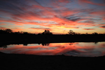 Reflection of clouds in lake during sunset