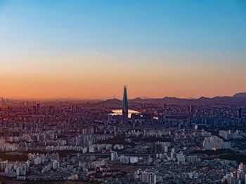 High angle view of city at sunset