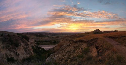 Scenic view of landscape against sky during sunset