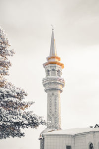 Low angle view of mosque  against sky. minaret. 