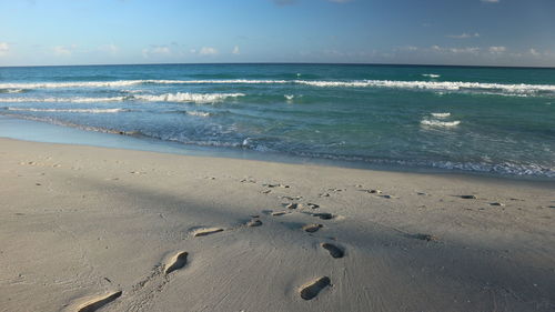 Scenic view of beach against sky