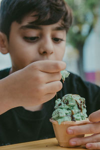 Close-up portrait of boy holding ice cream