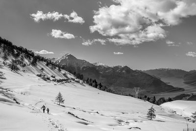 Scenic view of snowcapped mountains against sky