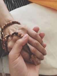 Close-up of coupe holding hands 