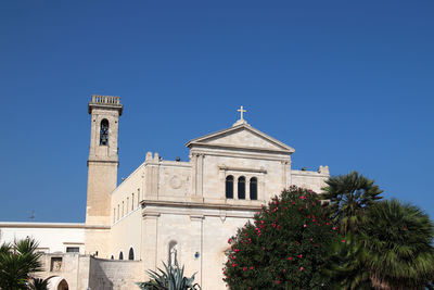 Low angle view of church against clear blue sky