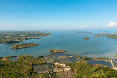 Top view of sea fish farm. cages for fish farming dorado and seabass. philippines, luzon.