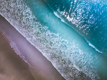 High angle view of surf on beach