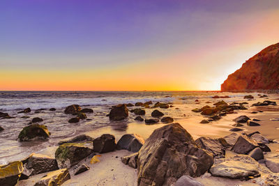 Scenic view of sea against clear sky during sunset