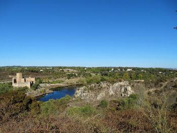 Scenic view of landscape against clear blue sky