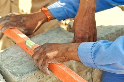 Close-up of man working on wood