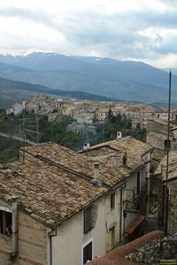 High angle view of houses against cloudy sky