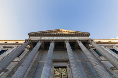 Low angle view of historical building against blue sky