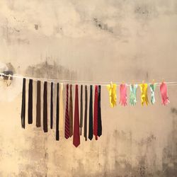 Clothes drying on clothesline against wall