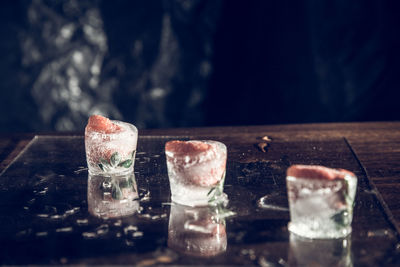 Close-up of glasses on table