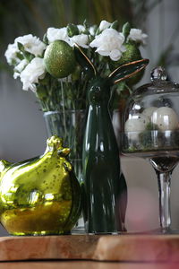 Close-up of wedding rings on table