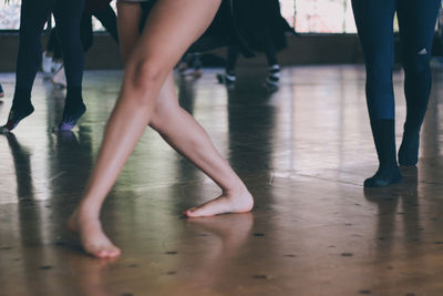 Low section of women in dance studio