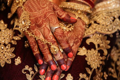 Close-up of human hand with tattoo
