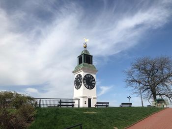 Low angle view of building against cloudy sky