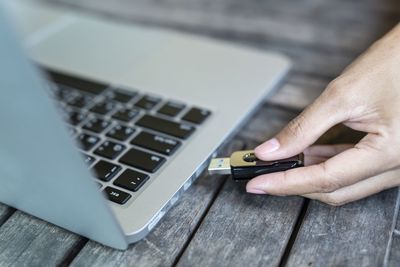 High angle view of person using laptop on table