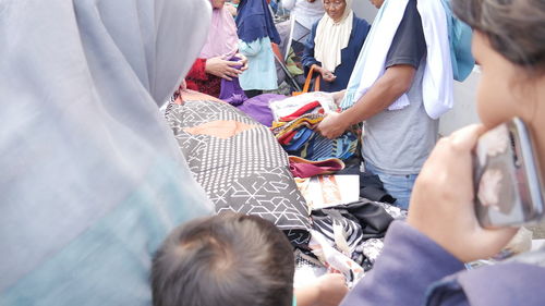 High angle view of people standing against the wall