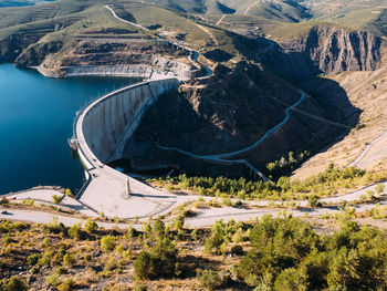 Aerial view of the atazar reservoir and dam in the mountain range of madrid