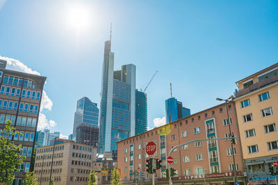 Low angle view of buildings against clear blue sky