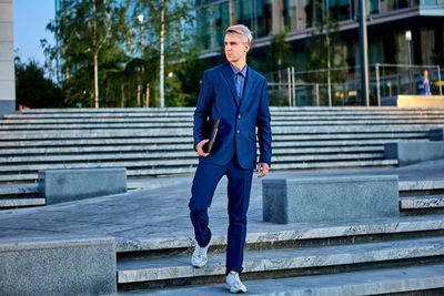 Full length of man standing on steps