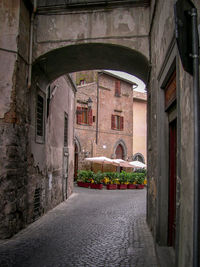 Narrow alley amidst buildings in city