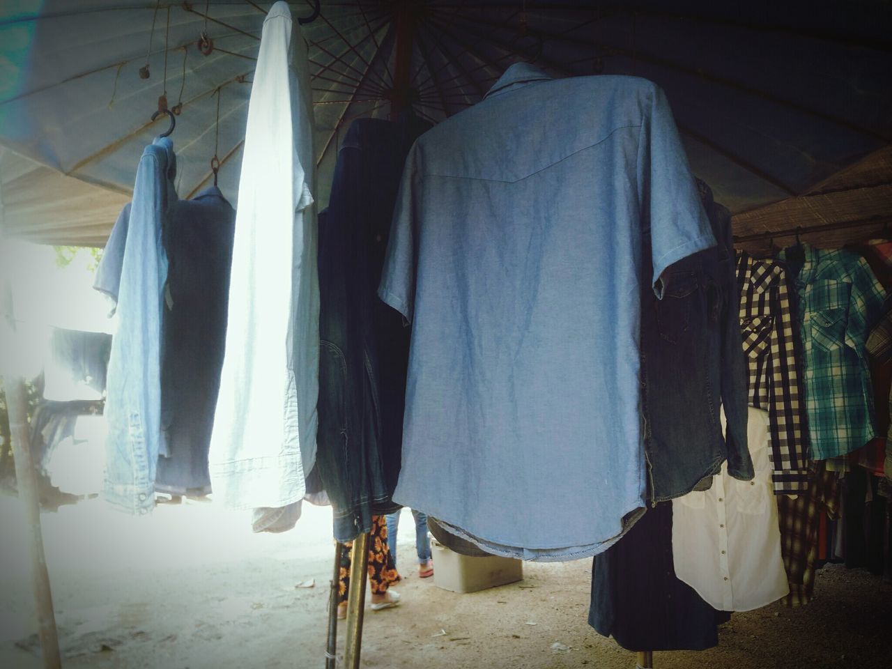 ROW OF CLOTHES DRYING ON CLOTHESLINE