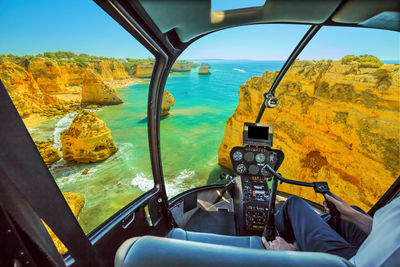 Scenic view of sea seen through airplane window