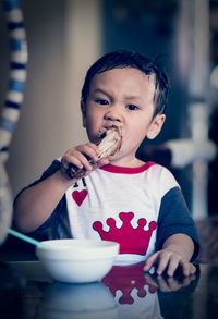 Portrait of cute boy holding ice cream
