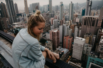 Woman looking at cityscape