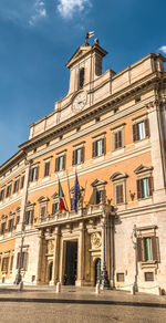 Low angle view of building against blue sky