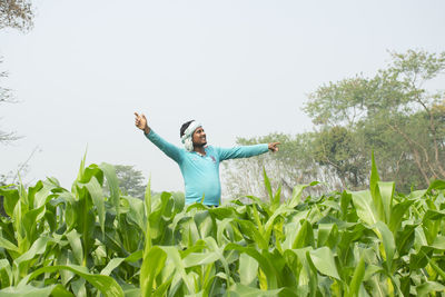 Full length of man standing on field against sky