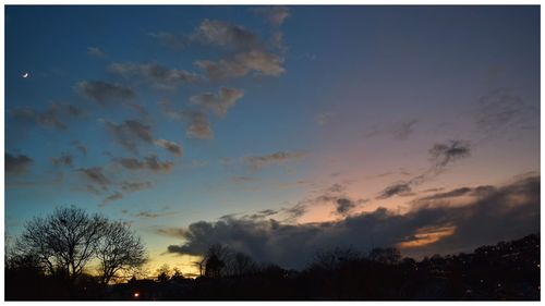 Silhouette of trees against sky at sunset