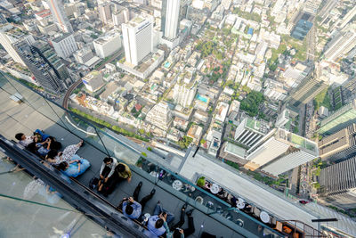 High angle view of crowd on street amidst buildings in city