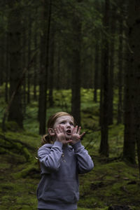 Girl shouting in forest