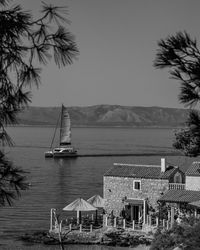 Sailboat on sea against sky