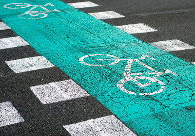 High angle view of arrow symbol on road