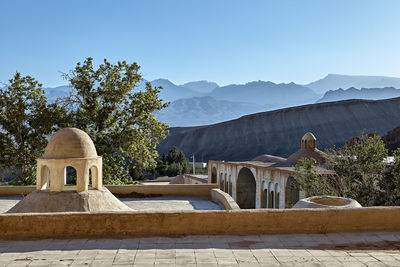 View of a building with mountain range in the background